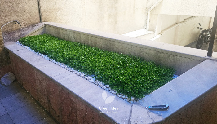 نمونه کار | اجرای باغچه مصنوعی برای زیباسازی پارکینگ مجتمع مسکونی